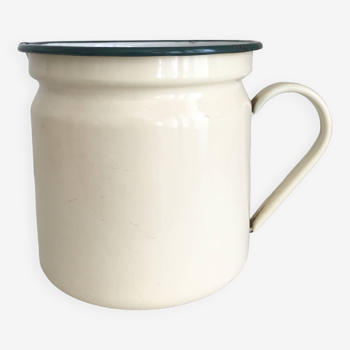 Old milk jug in enameled sheet metal