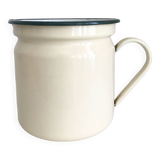 Old milk jug in enameled sheet metal