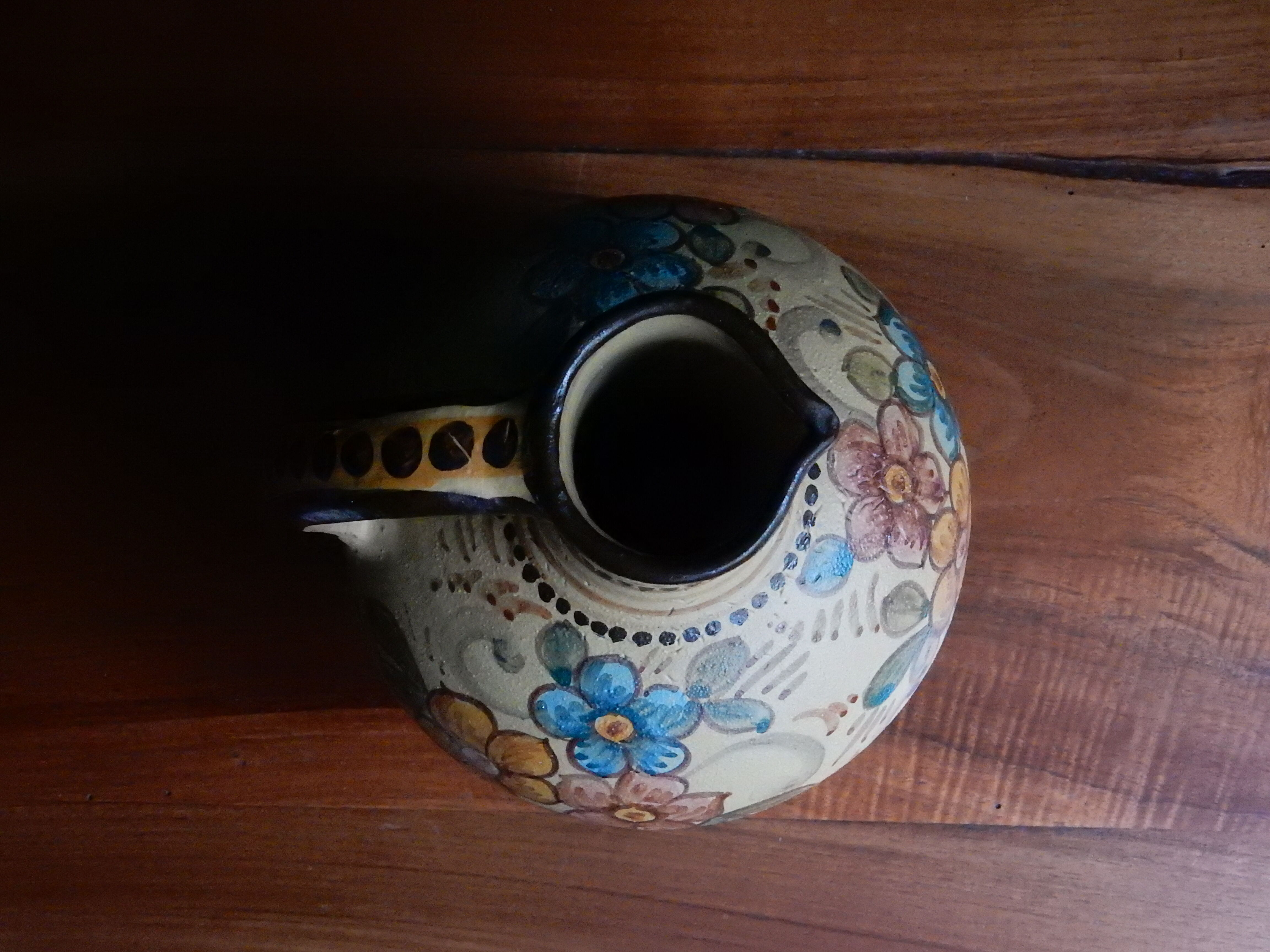 Hand-painted terracotta jug