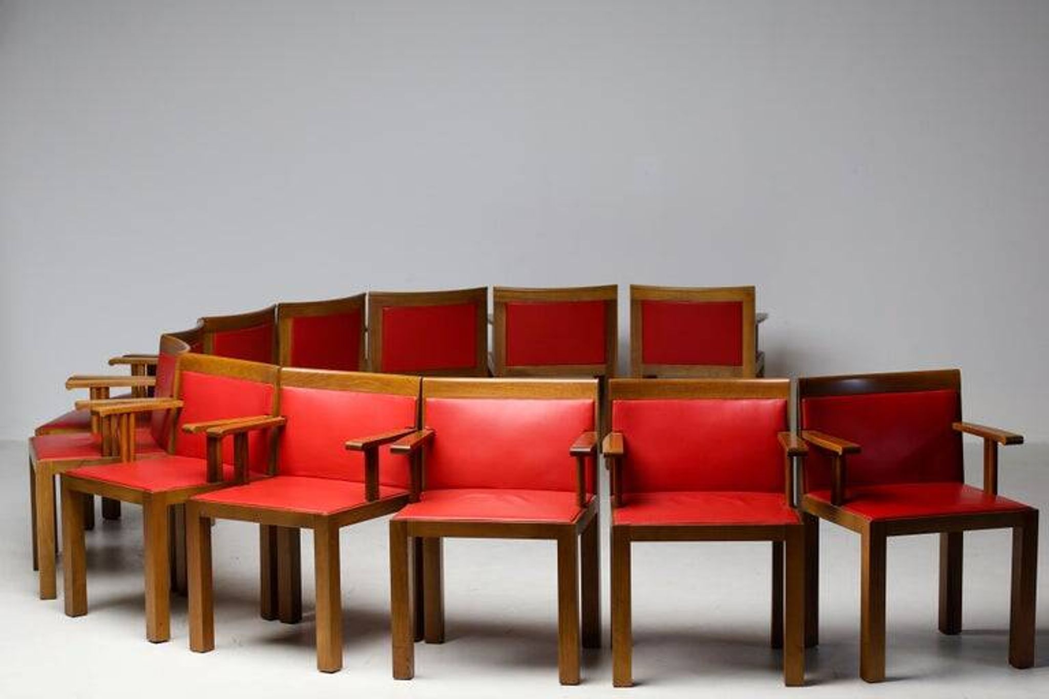A masterpiece of Italian modernism: eleven Aldo Rossi red Teatro arm chairs