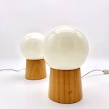 Pair of lamps with wooden base and glass globe, 1970s