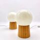 Pair of lamps with wooden base and glass globe, 1970s
