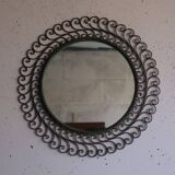 Large round vintage mirror in black metal with green patina