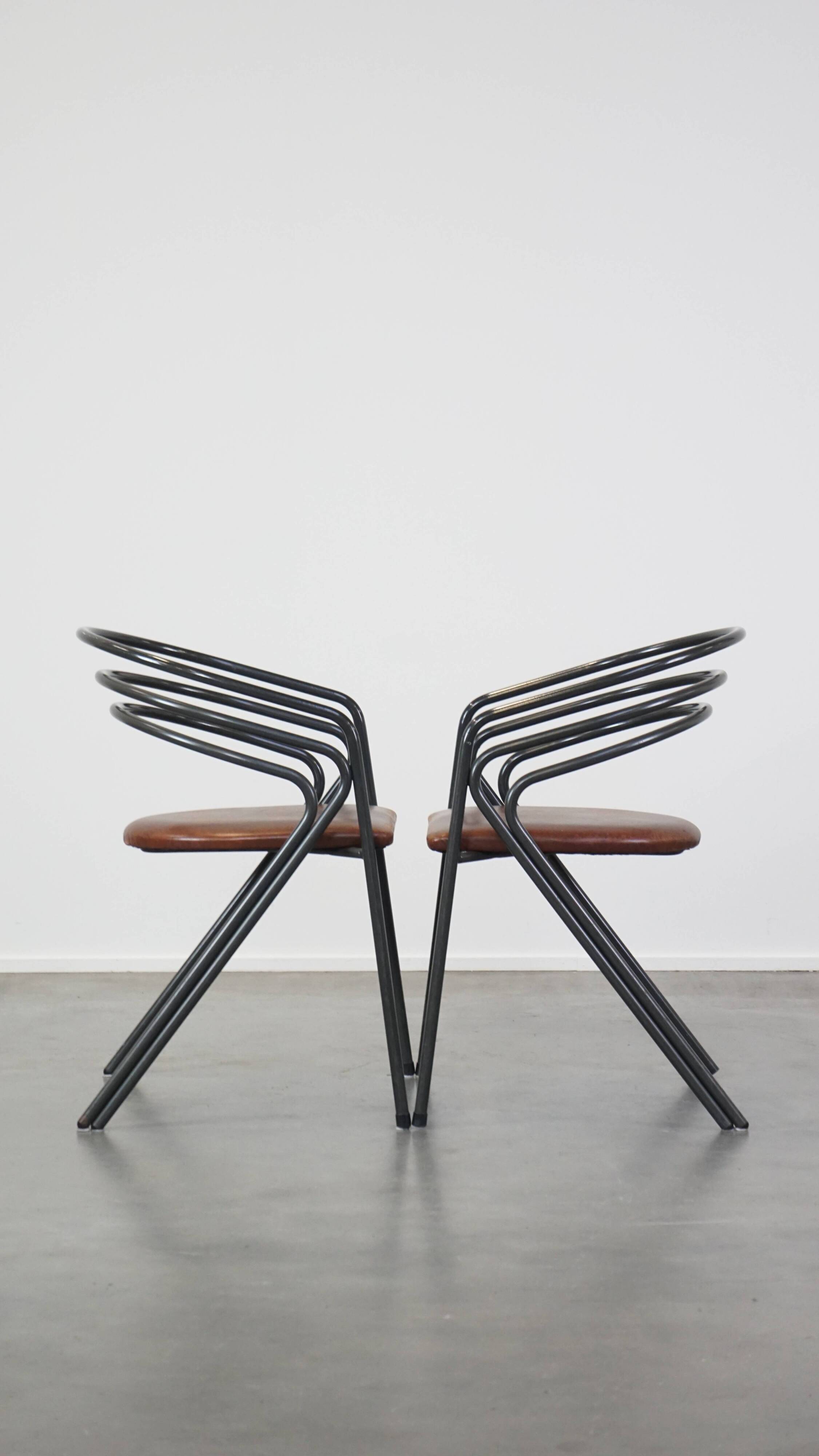 Set of 4 1970s design dining chairs with leather seats and metal frame
