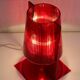 Red plastic Kartell table lamp - model Take - design by Ferruccio Laviani