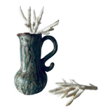 Old pitcher in glazed terracotta