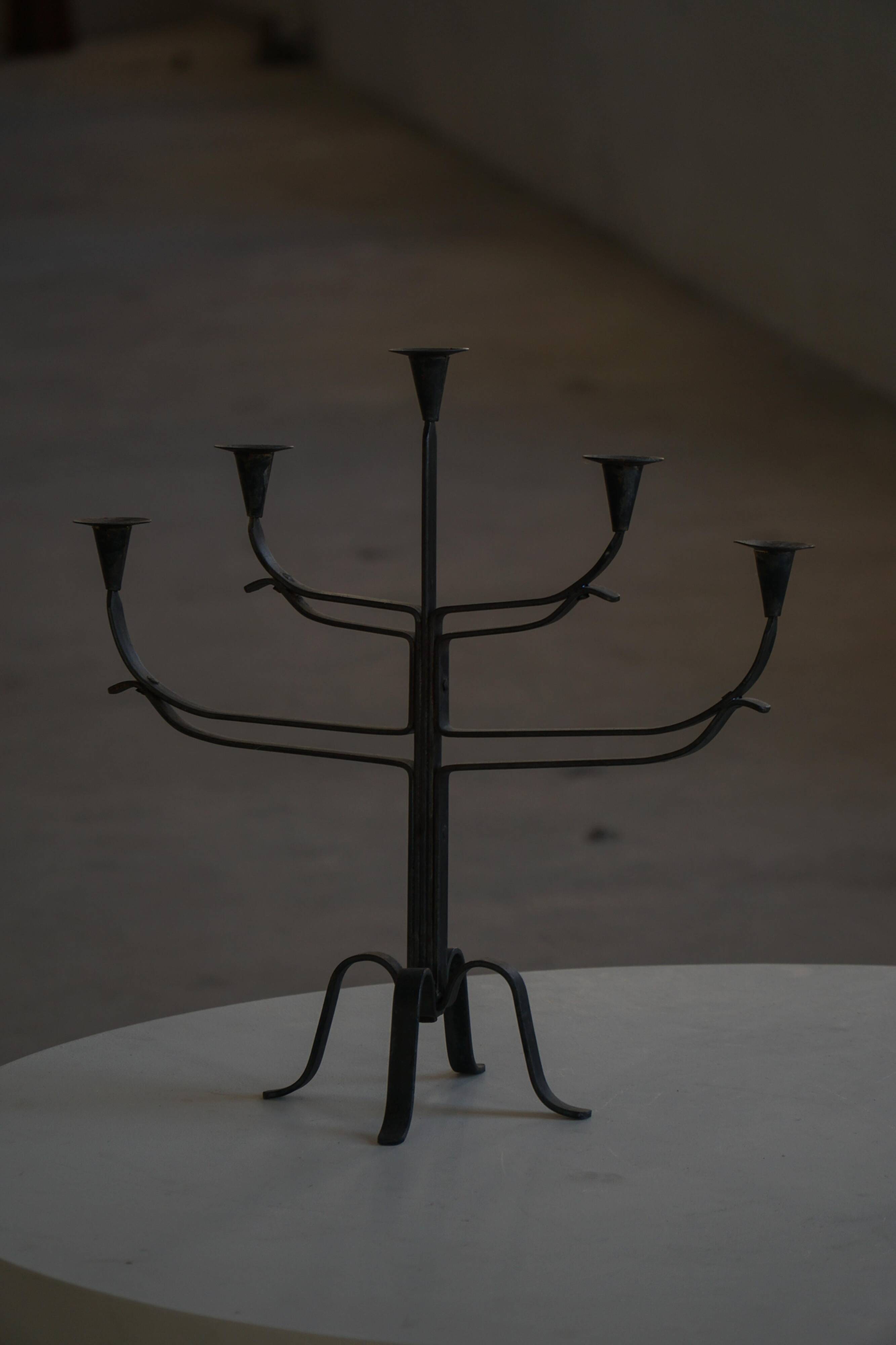 Brutalist Scandinavian candlestick in wrought iron and metal from the mid-20th century.