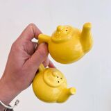 Salt and pepper shakers in the shape of a teapot.