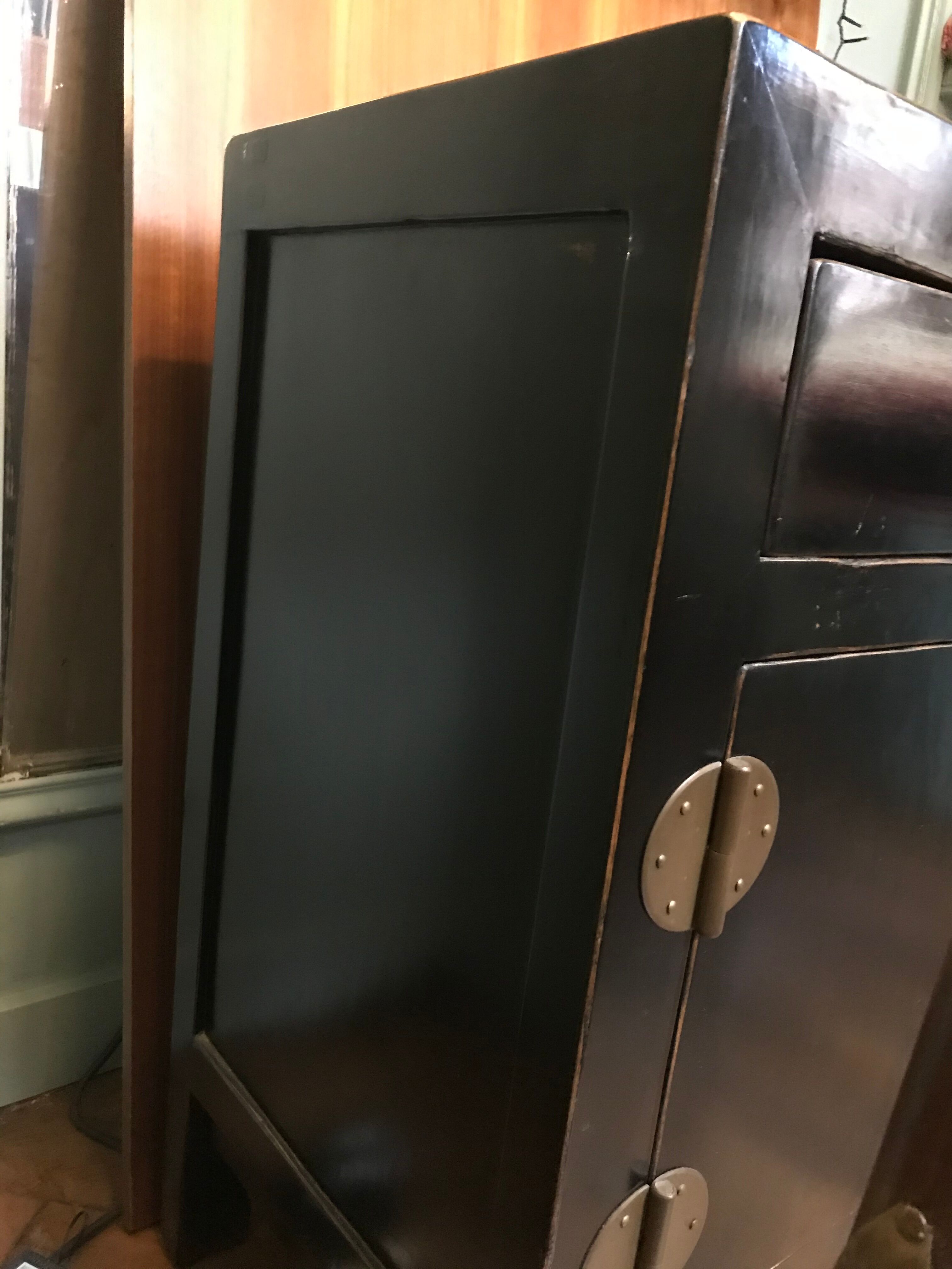 Chinese chest of drawers in black lacquer and brass