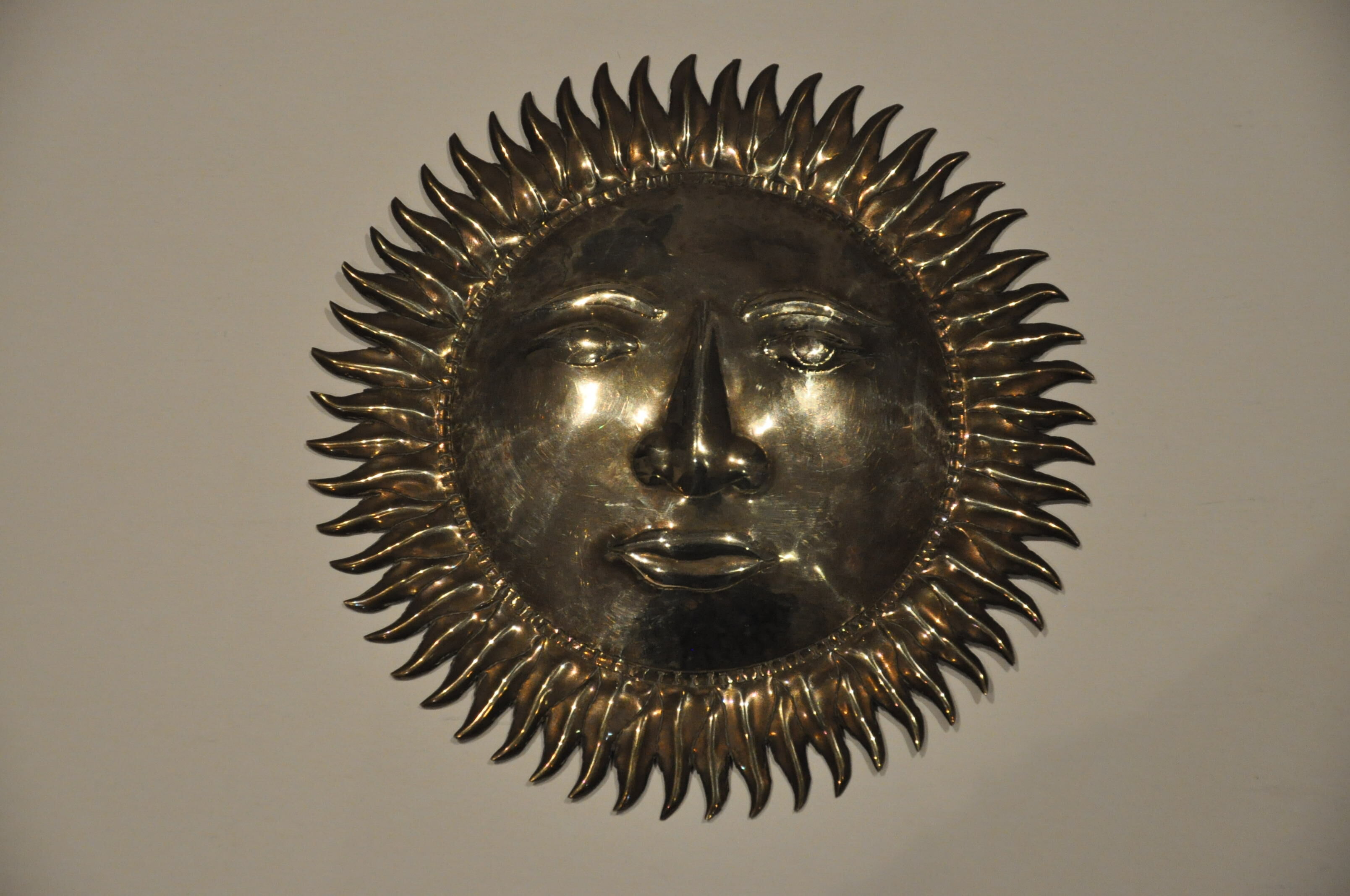 Vintage brass sun
