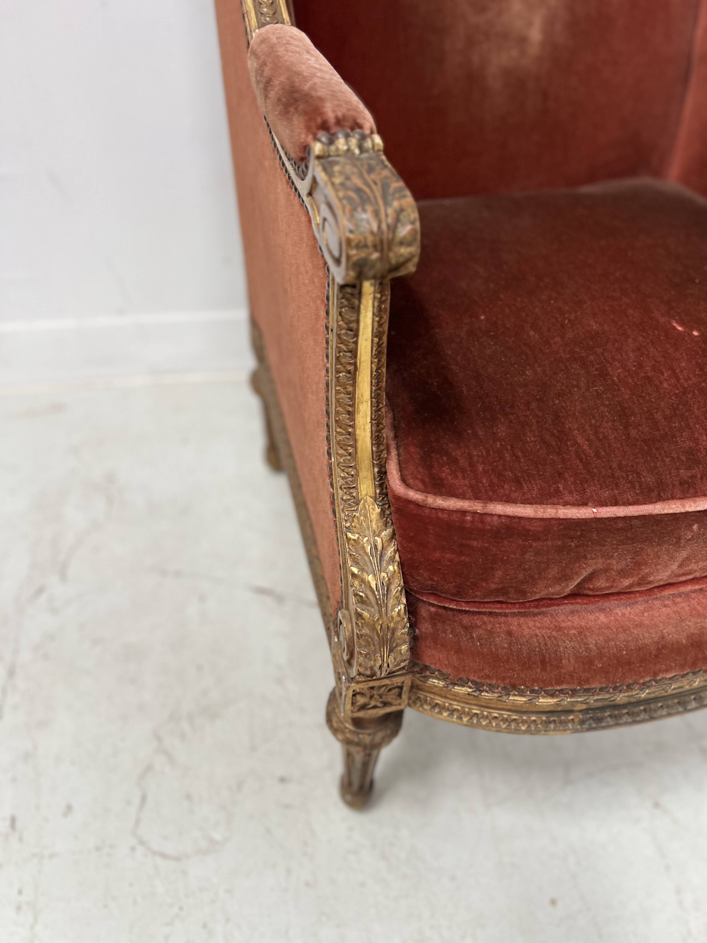 Two Louis XVI style wing chairs in gilded wood, 20th century