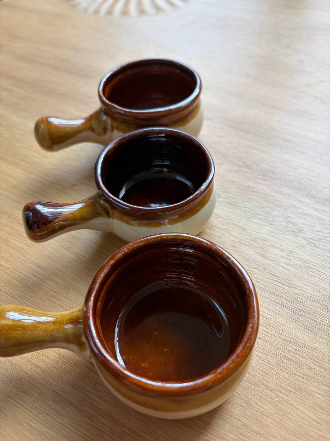 Set of 3 small glazed stoneware ramekins.