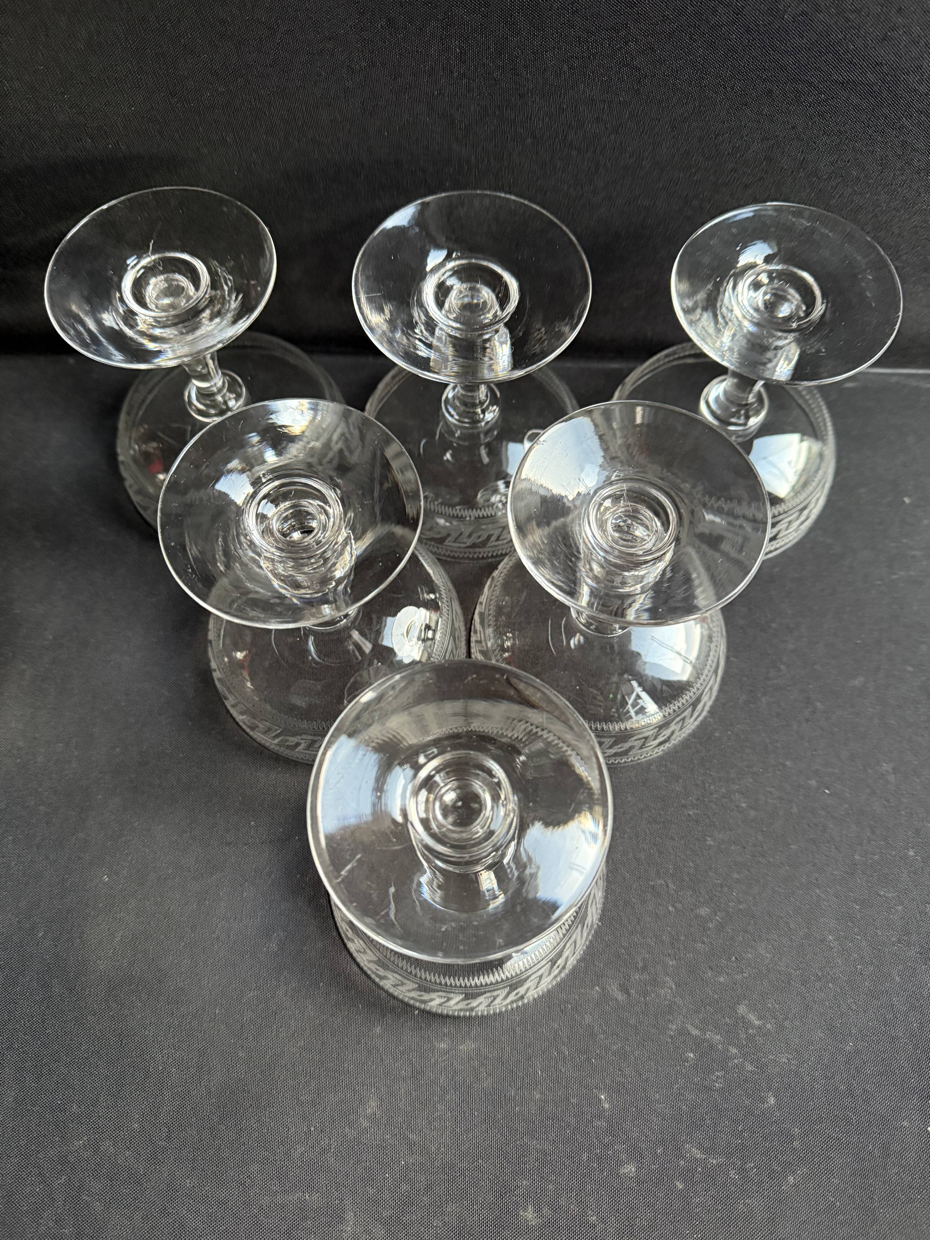 6 Baccarat champagne coupes with Greek engraving, slanted.