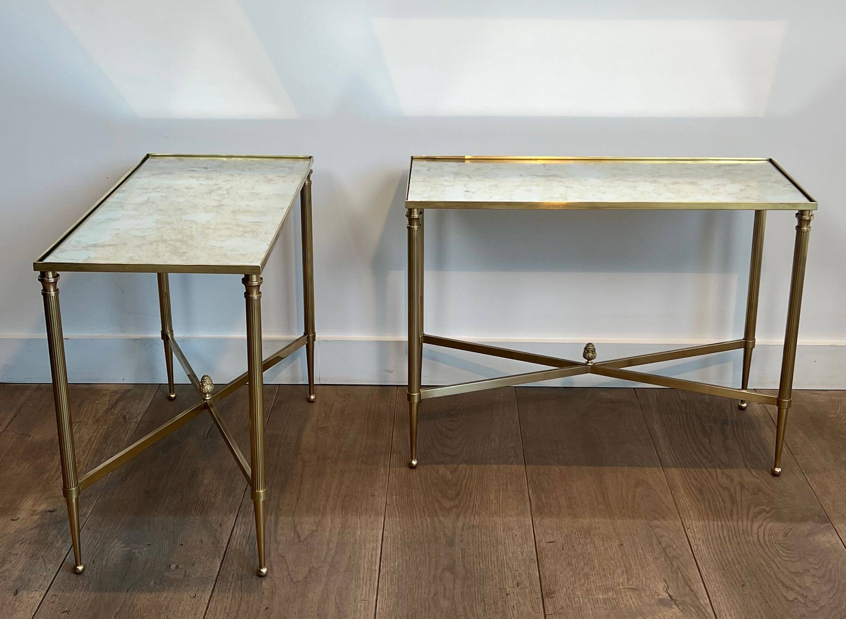 Pair of brass side tables with antique mirrored tops from Maison Jansen