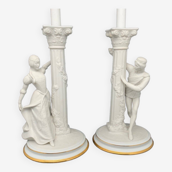 Pair of porcelain and white biscuit candlesticks