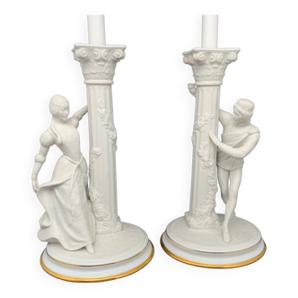 Pair of porcelain and white biscuit candlesticks