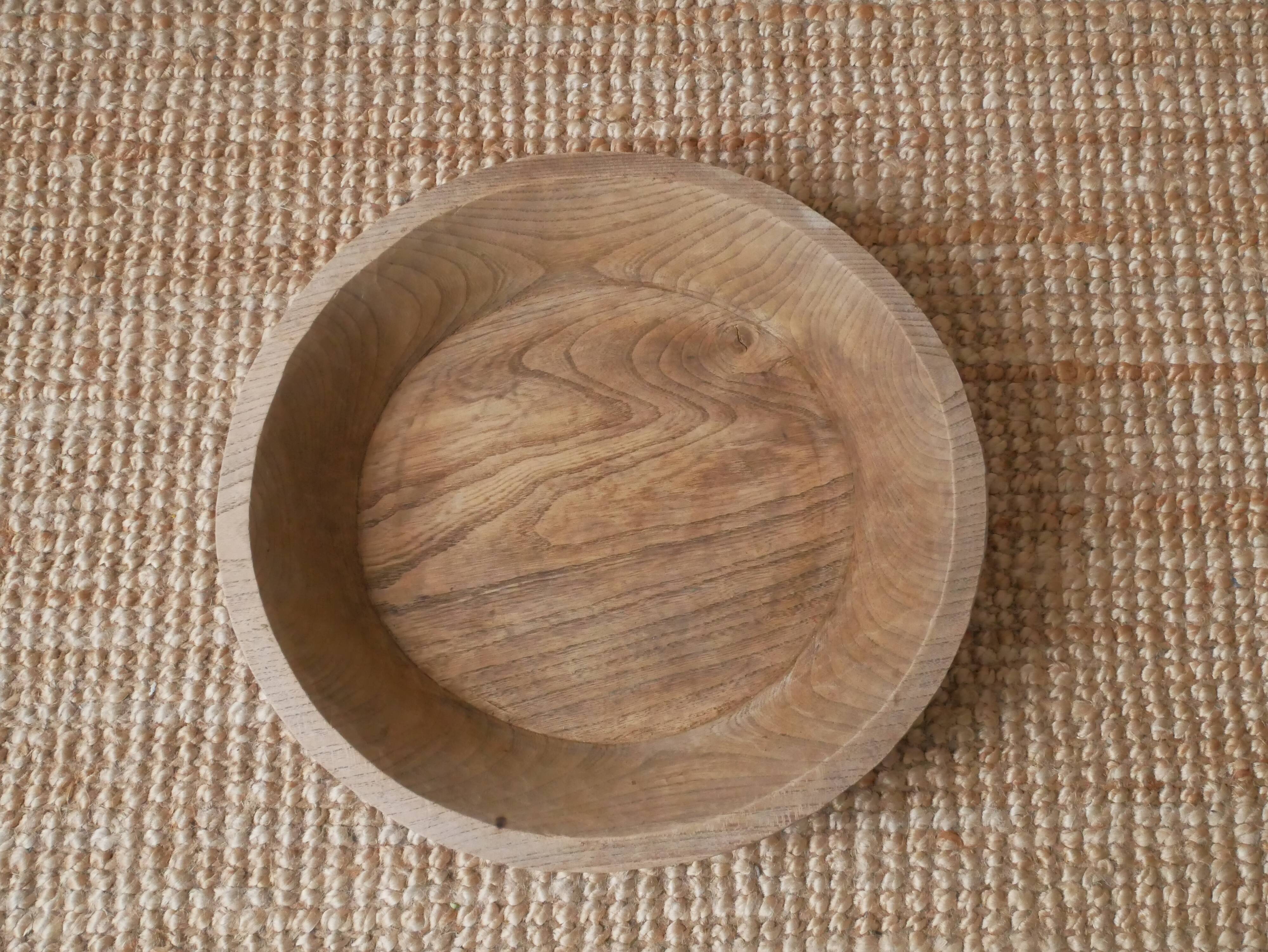 Raw wooden dish carved in the mass ethnic African art handmade artisanal manufacturing