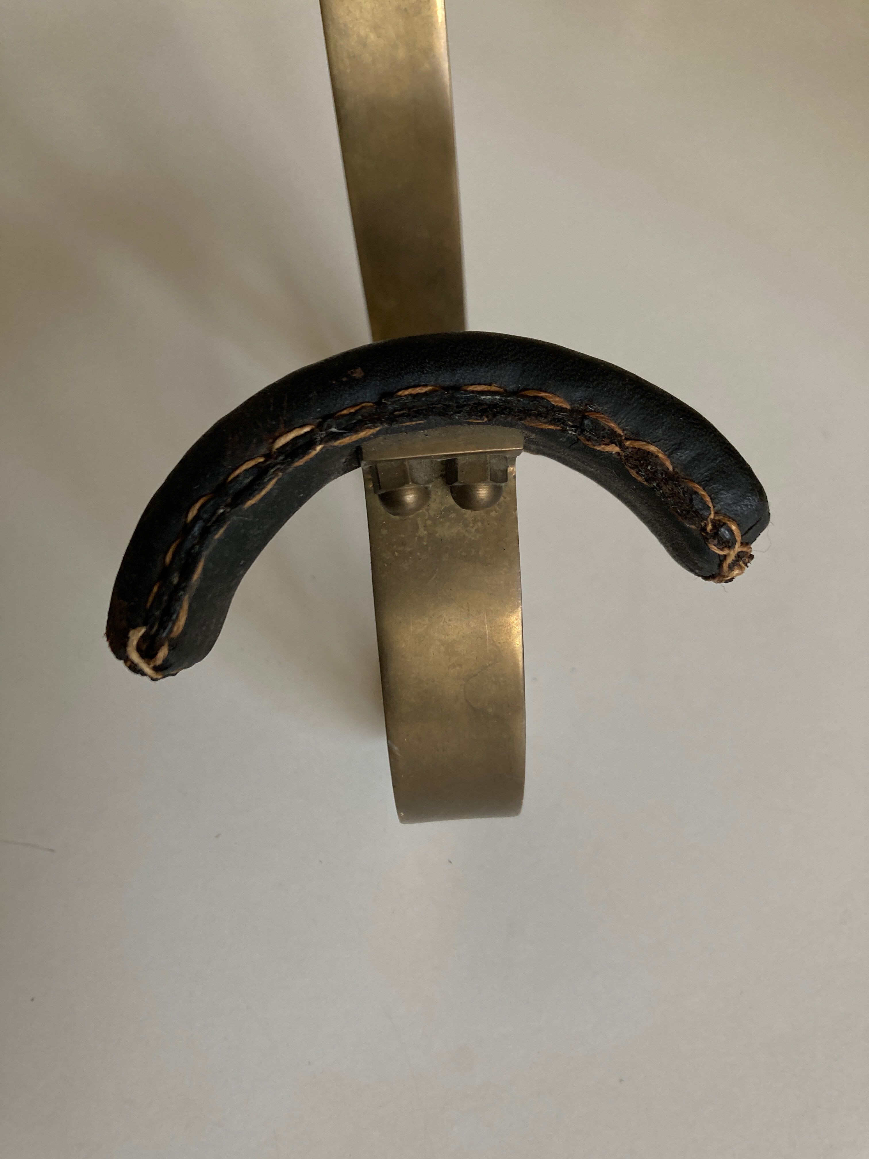 Adnet hook in bronze and leather 1950