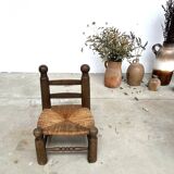 Brutalist chair in wood and straw