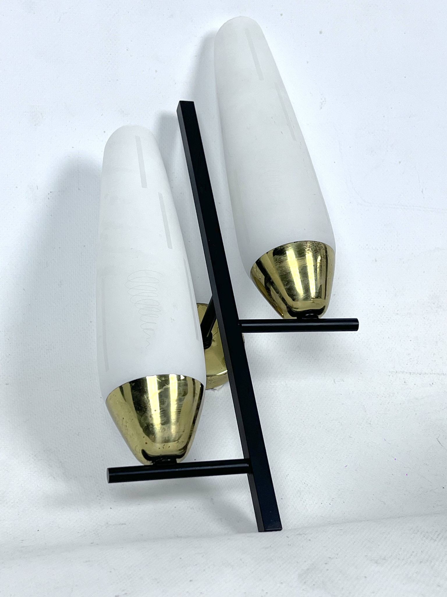 Mid-Century pair of double lights sconces in brass and opaline glass. Italy 1950s