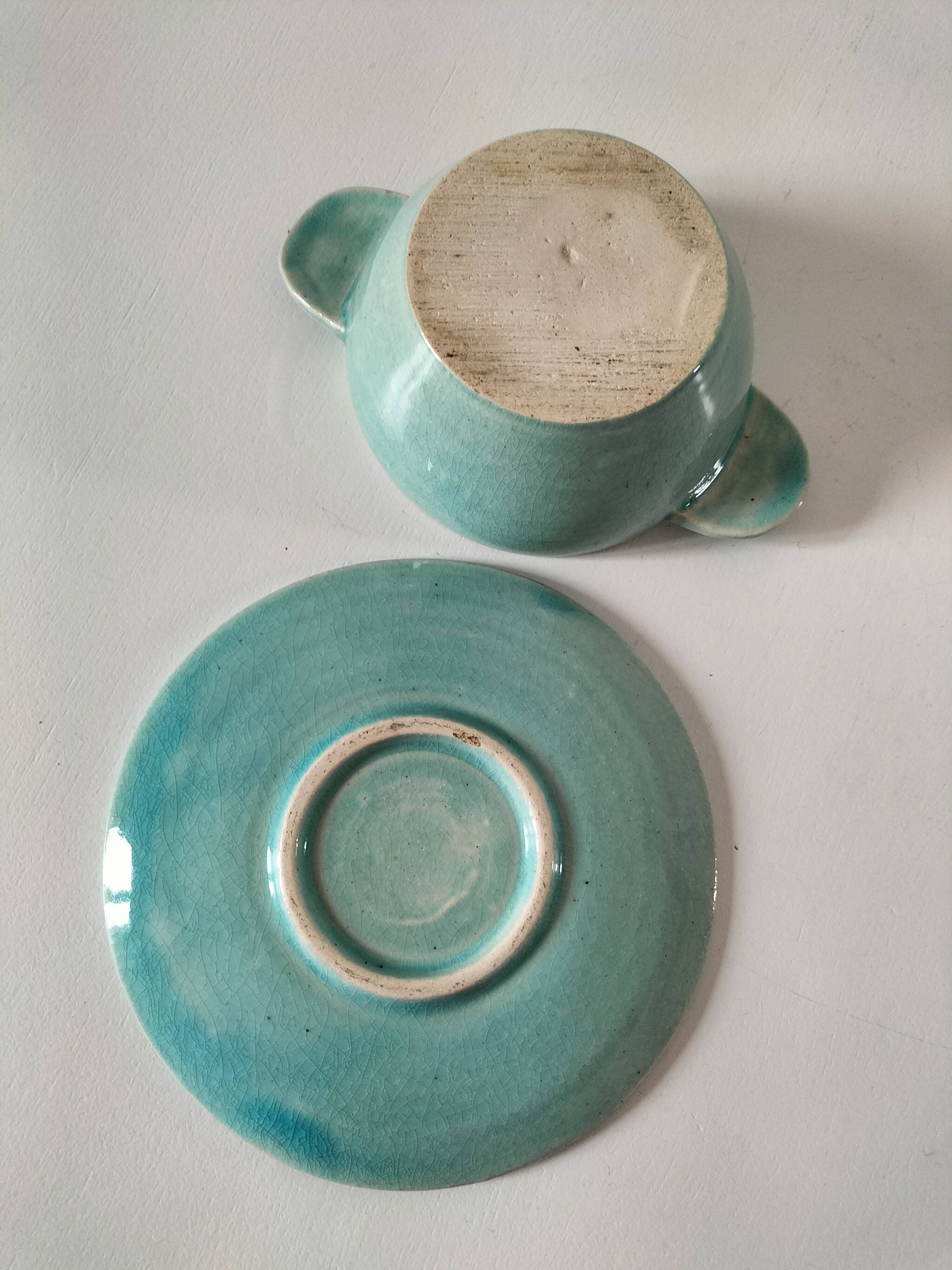 Earthenware bowl and saucer in glazed water green ceramic.