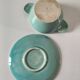 Earthenware bowl and saucer in glazed water green ceramic.
