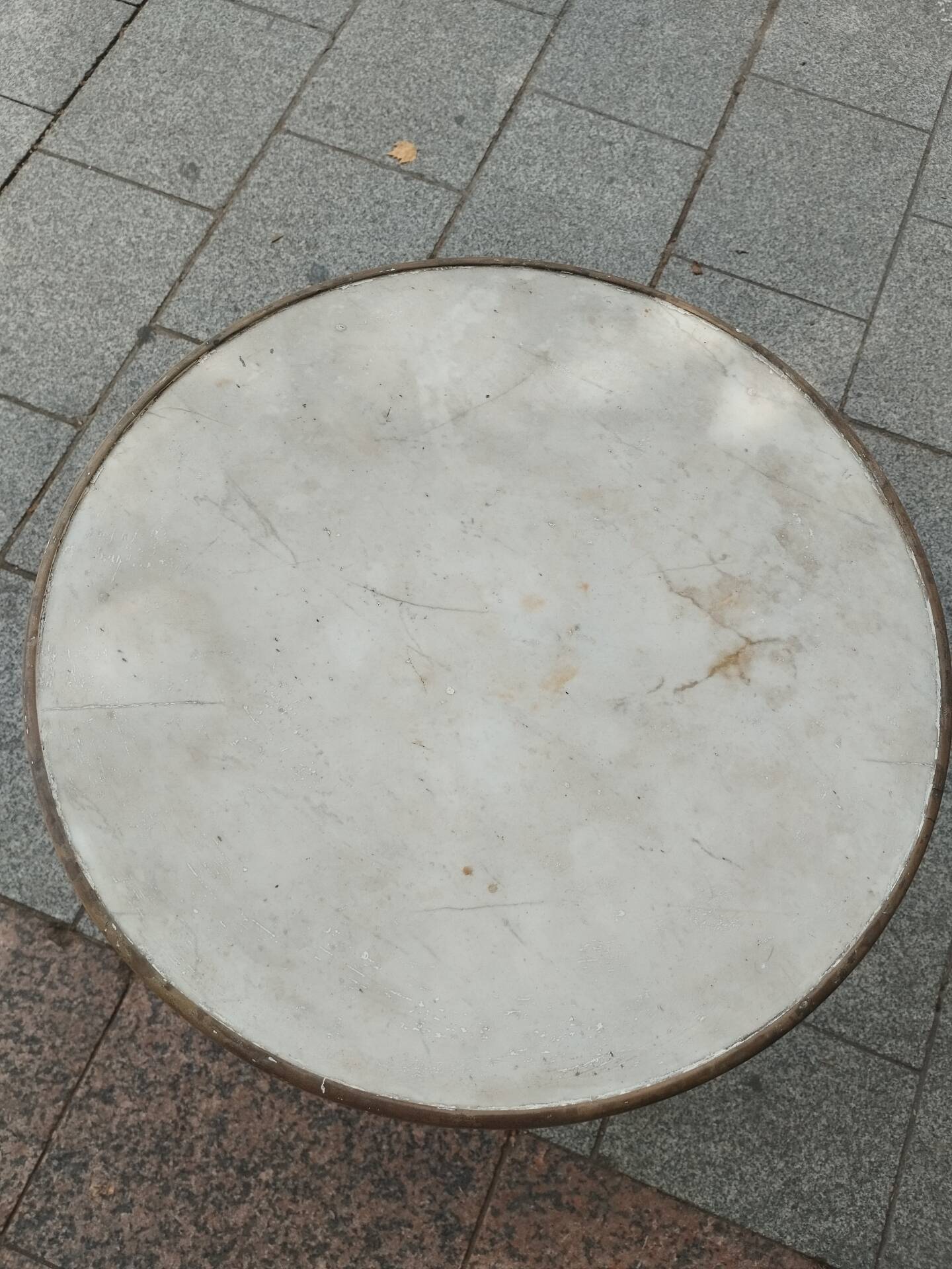 Old bistro table with marble top and cast iron base.