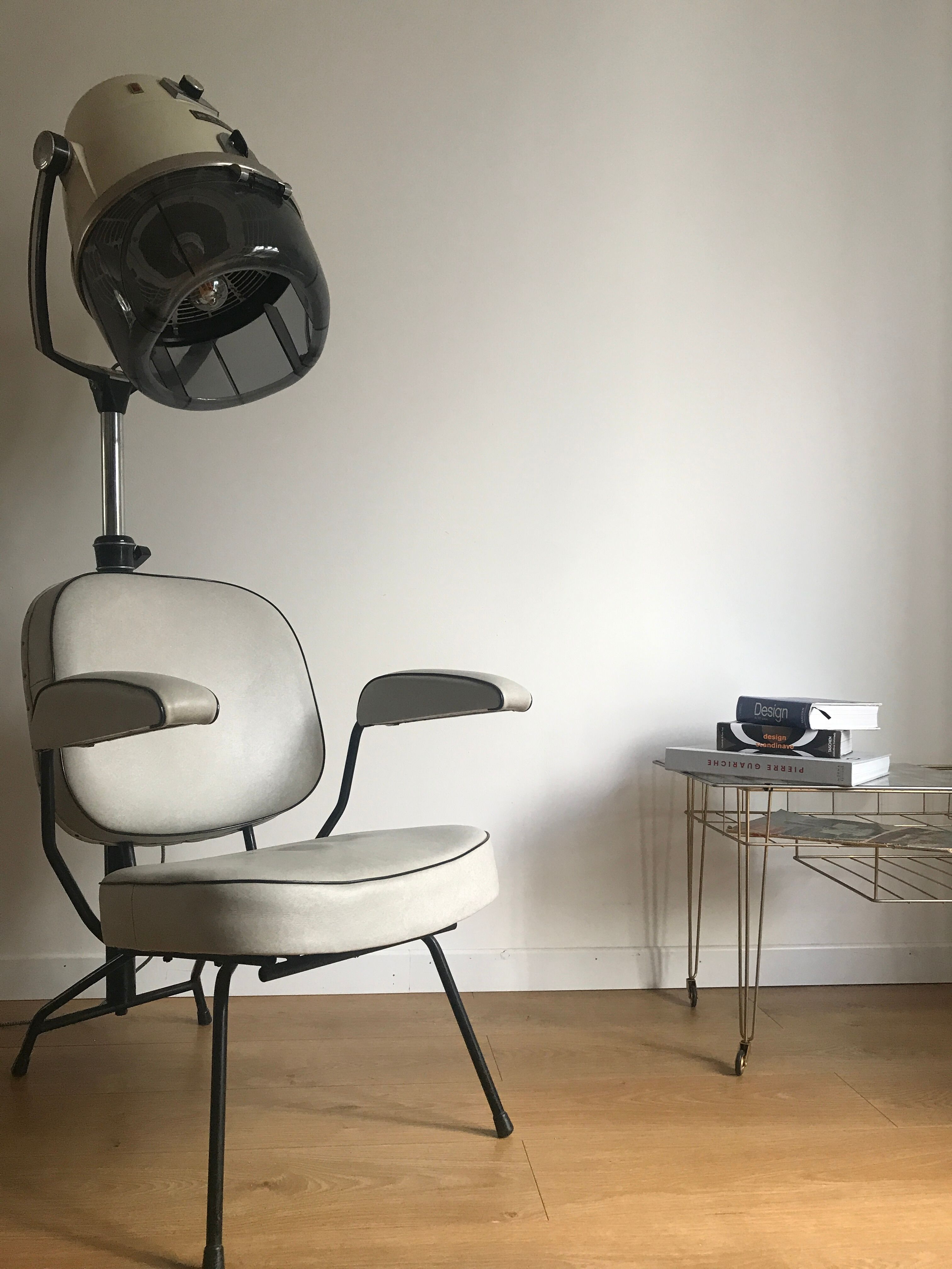 Vintage hairdresser's armchair with helmet transformed into a lamp