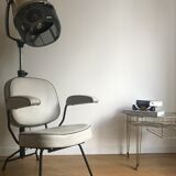 Vintage hairdresser's armchair with helmet transformed into a lamp