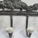 Patinated metal wall bracket and porcelain
