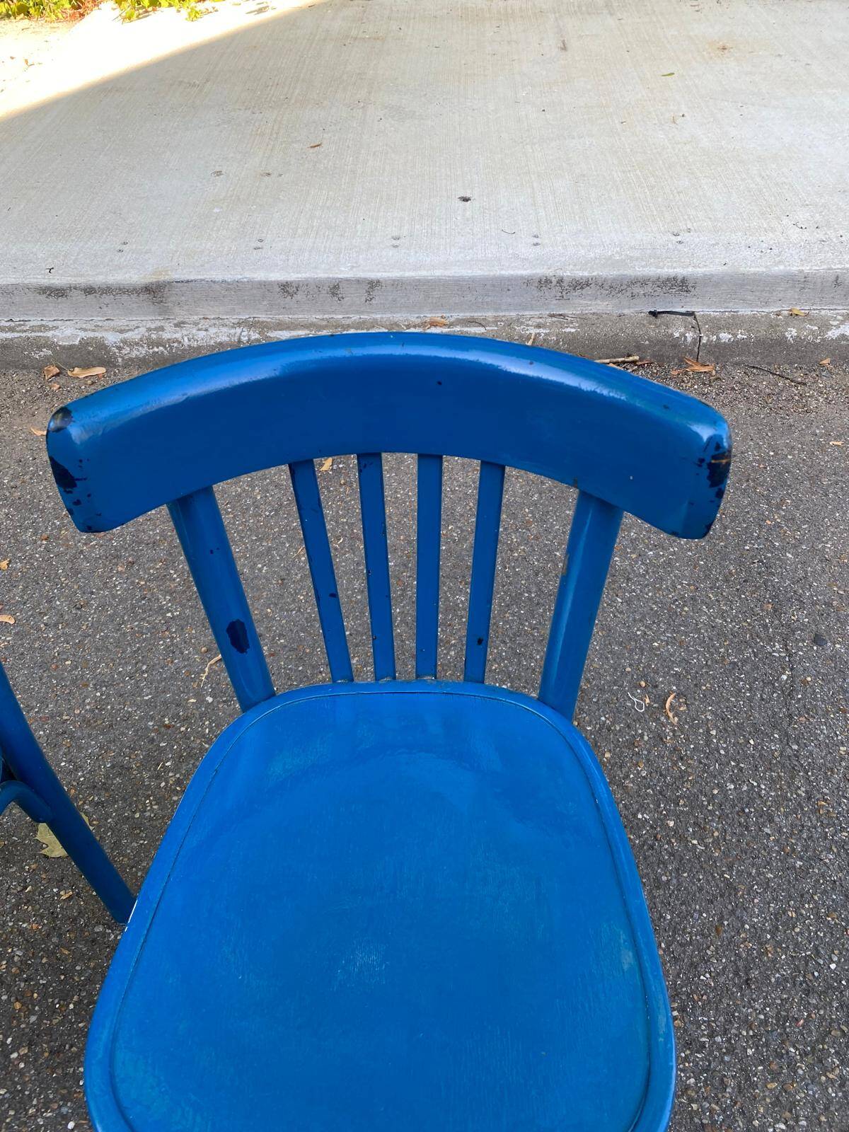 2 blue bistro chairs in curved solid wood