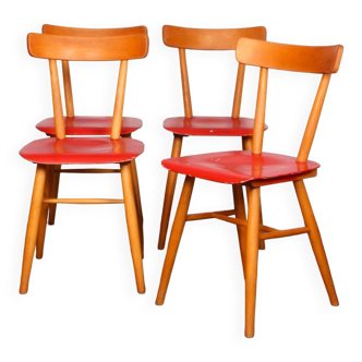Ensemble de quatre chaises rouges éditées par Ton 1960