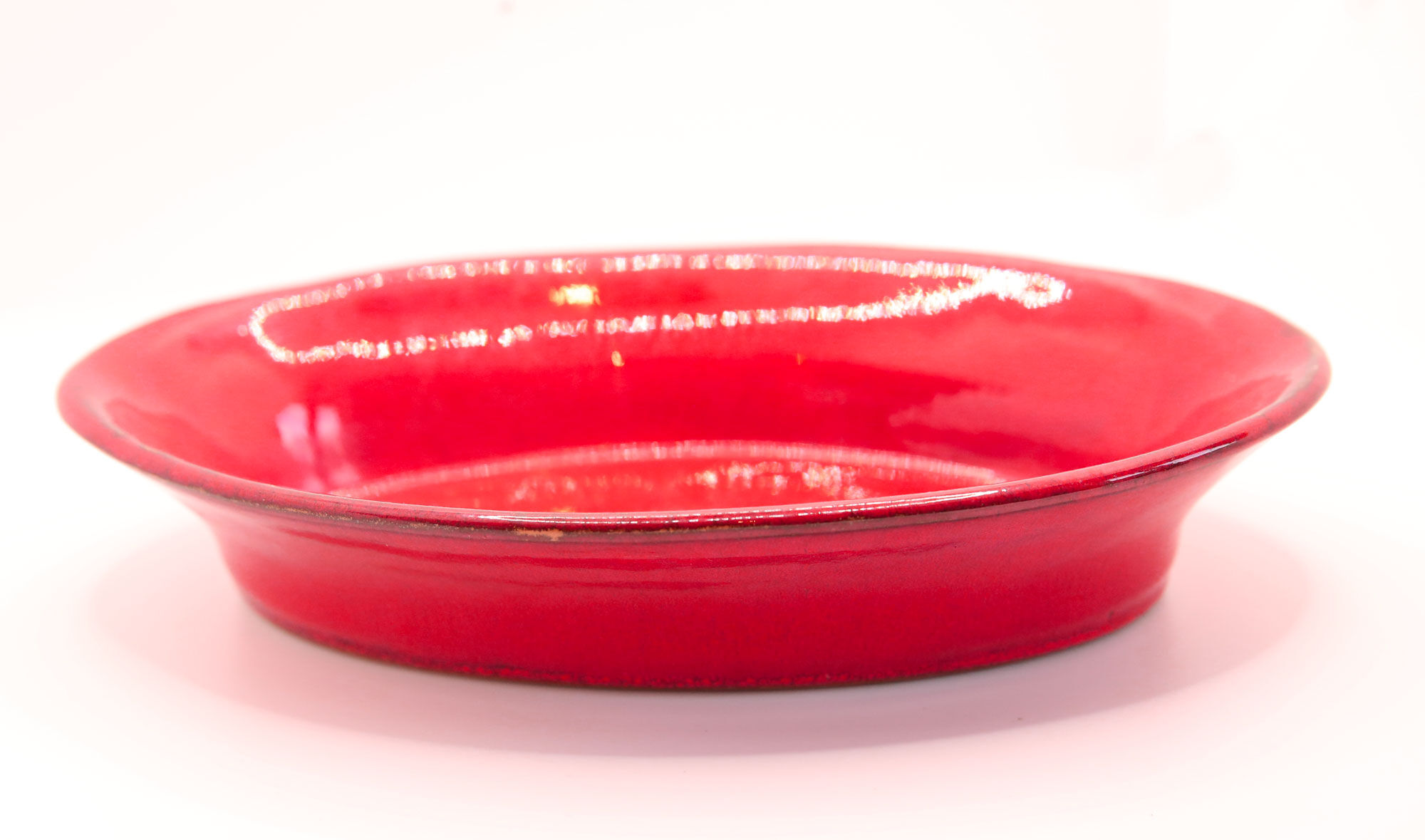 Handcrafted oval dish in scarlet red ceramic