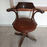 Thonet armchair, swivel, in wood and faux leather.