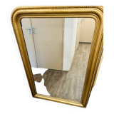 Antique gilded mirror in old Louis Philippe wood