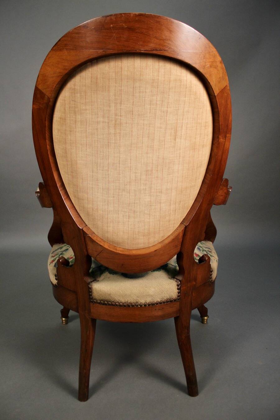 Pair of Louis Philippe armchairs with petit point upholstery.