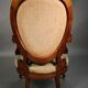 Pair of Louis Philippe armchairs with petit point upholstery.