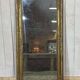 19th-century mirror in gilded wood and plaster.