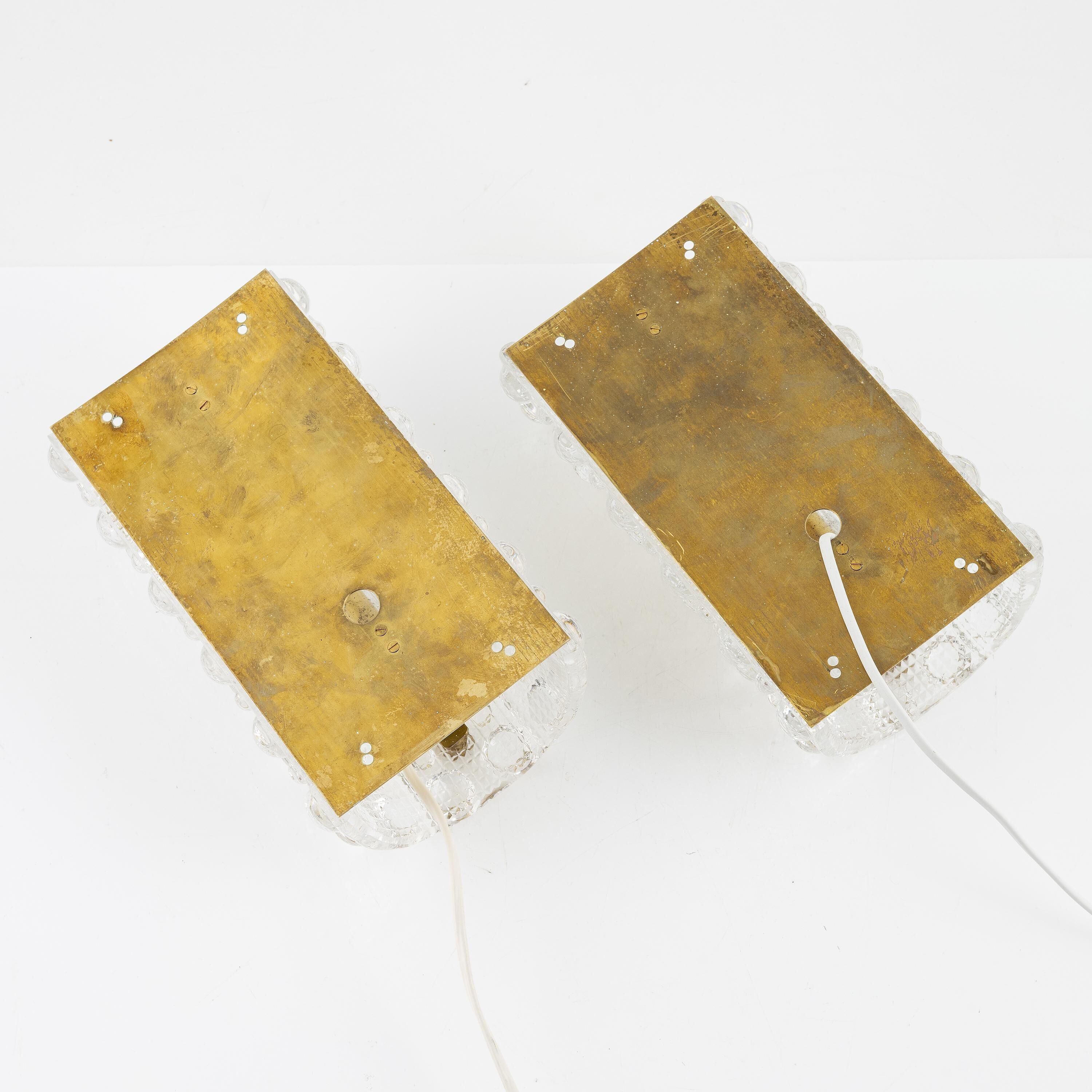 Carl Fagerlund, pair of glass wall lights for Lyfa, Orrefors Sweden, 1960.