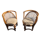Pair of vintage rattan armchairs with soft fabric seats