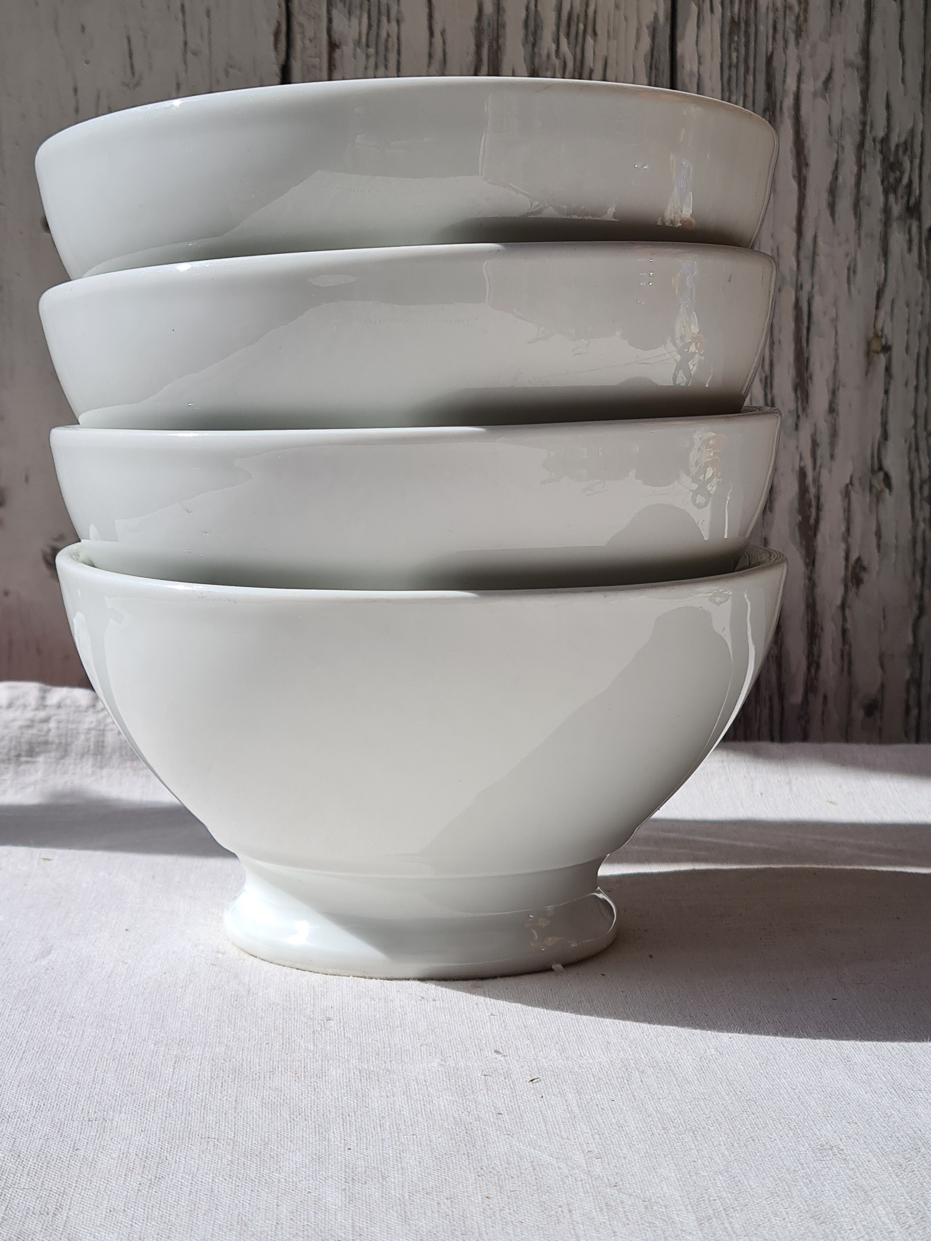 Four bowls made of thick white porcelain