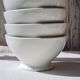 Four bowls made of thick white porcelain