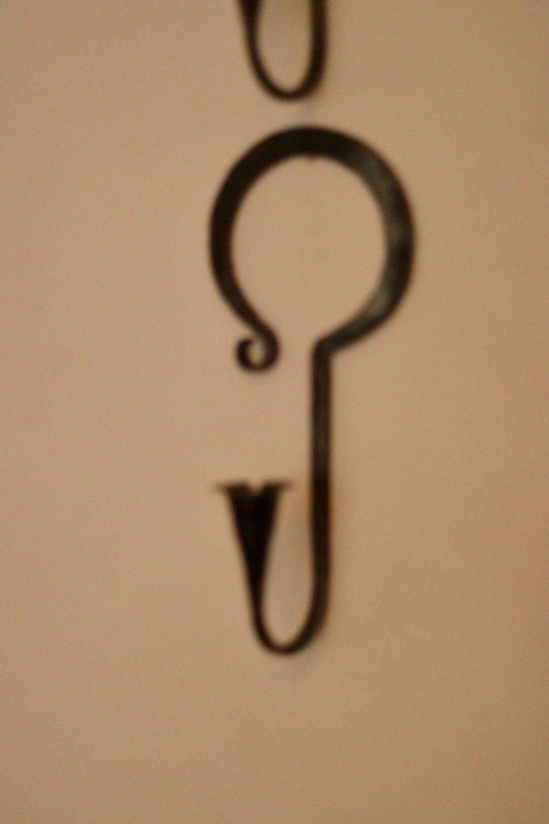 Pair of Swedish wall sconces in wrought iron, mid-20th century style, signed Akta.