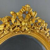Miroir ovale doré style Louis XVI, XIXe siècle