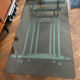 70s design coffee table in rectangular glass with chrome legs.