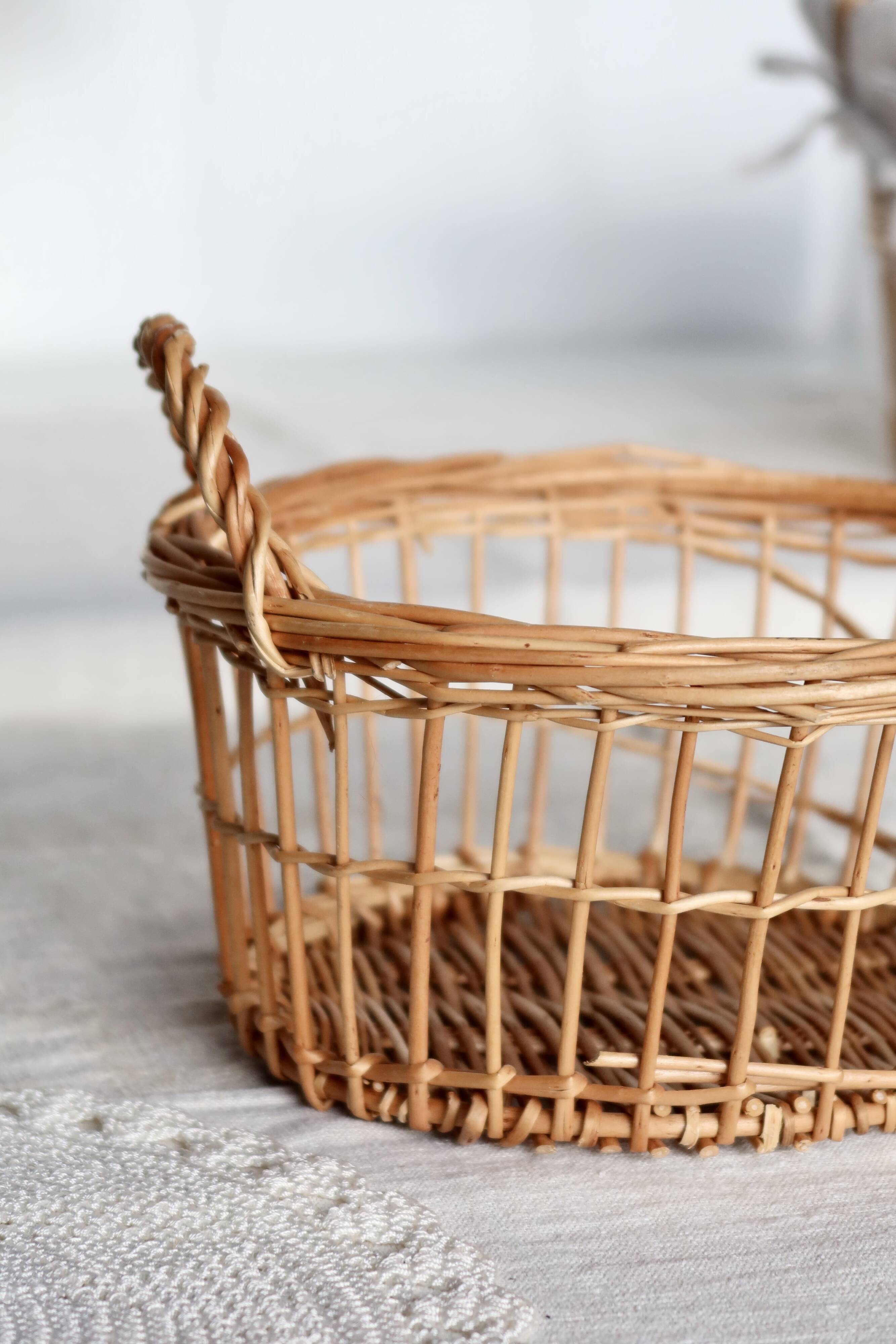 Round openwork wicker storage basket with braided handles