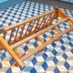 Curved wooden coat rack with shelf