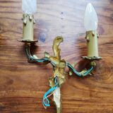 Pair of appliques with two arms of light with a leafy decoration