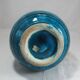 Islamic ceramic vase with turquoise background