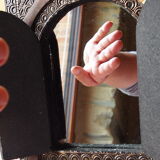 Vintage Moroccan mirror with chiseled pewter shutters